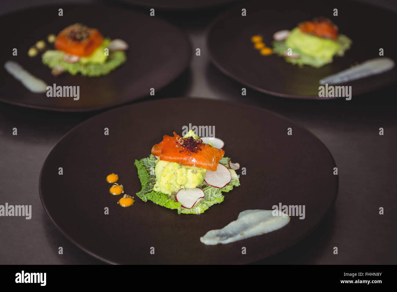 Plates of main course on counter Stock Photo