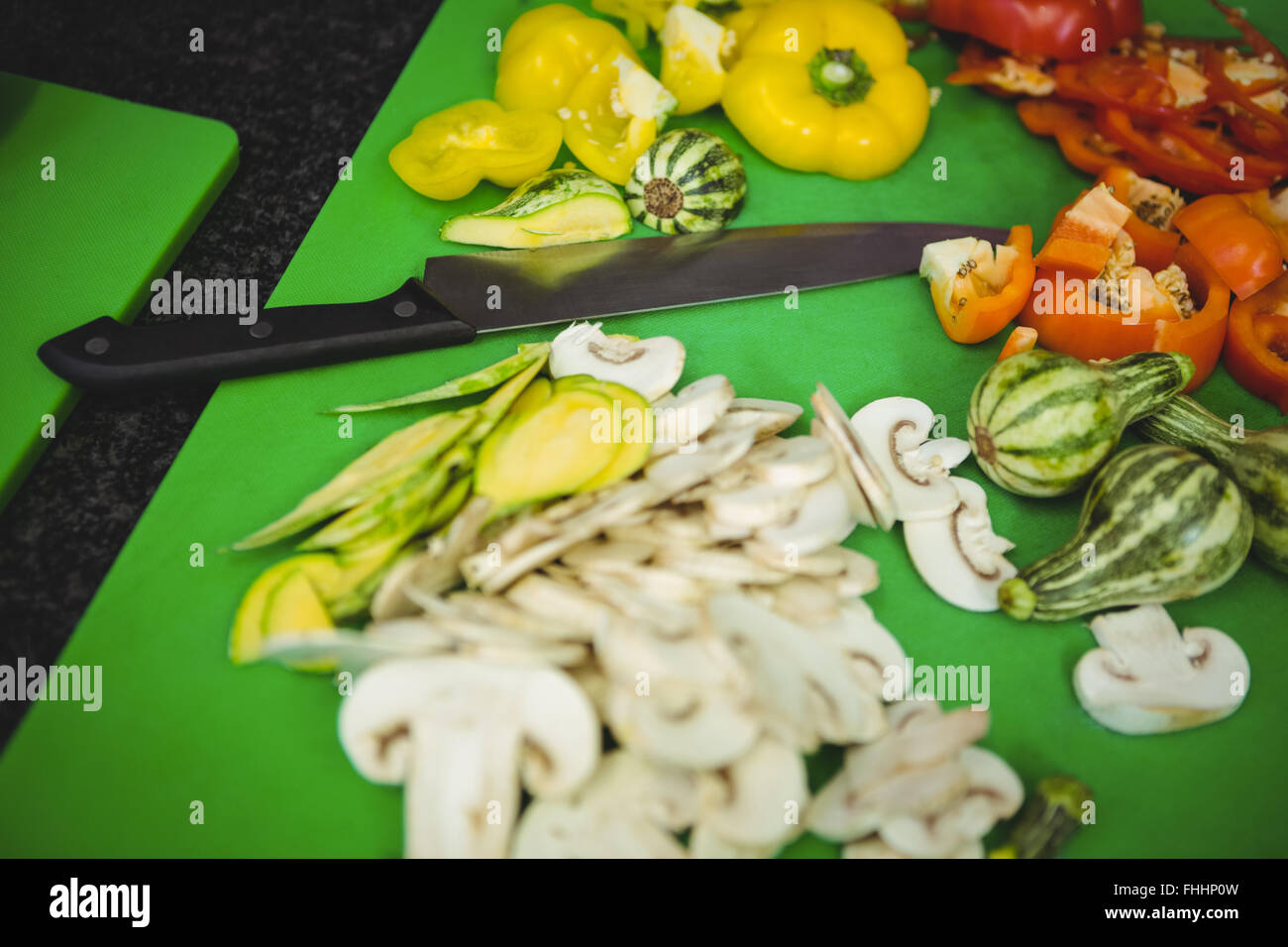 Sliced vegetables on chopping board Stock Photo
