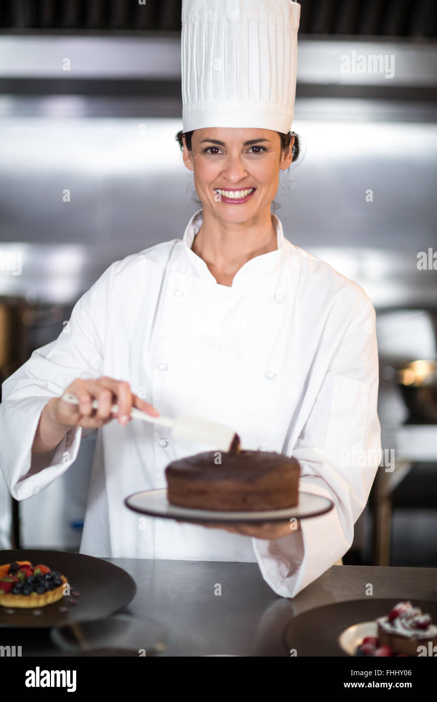 https://c8.alamy.com/comp/FHHY06/chef-putting-finishing-touch-on-dessert-FHHY06.jpg