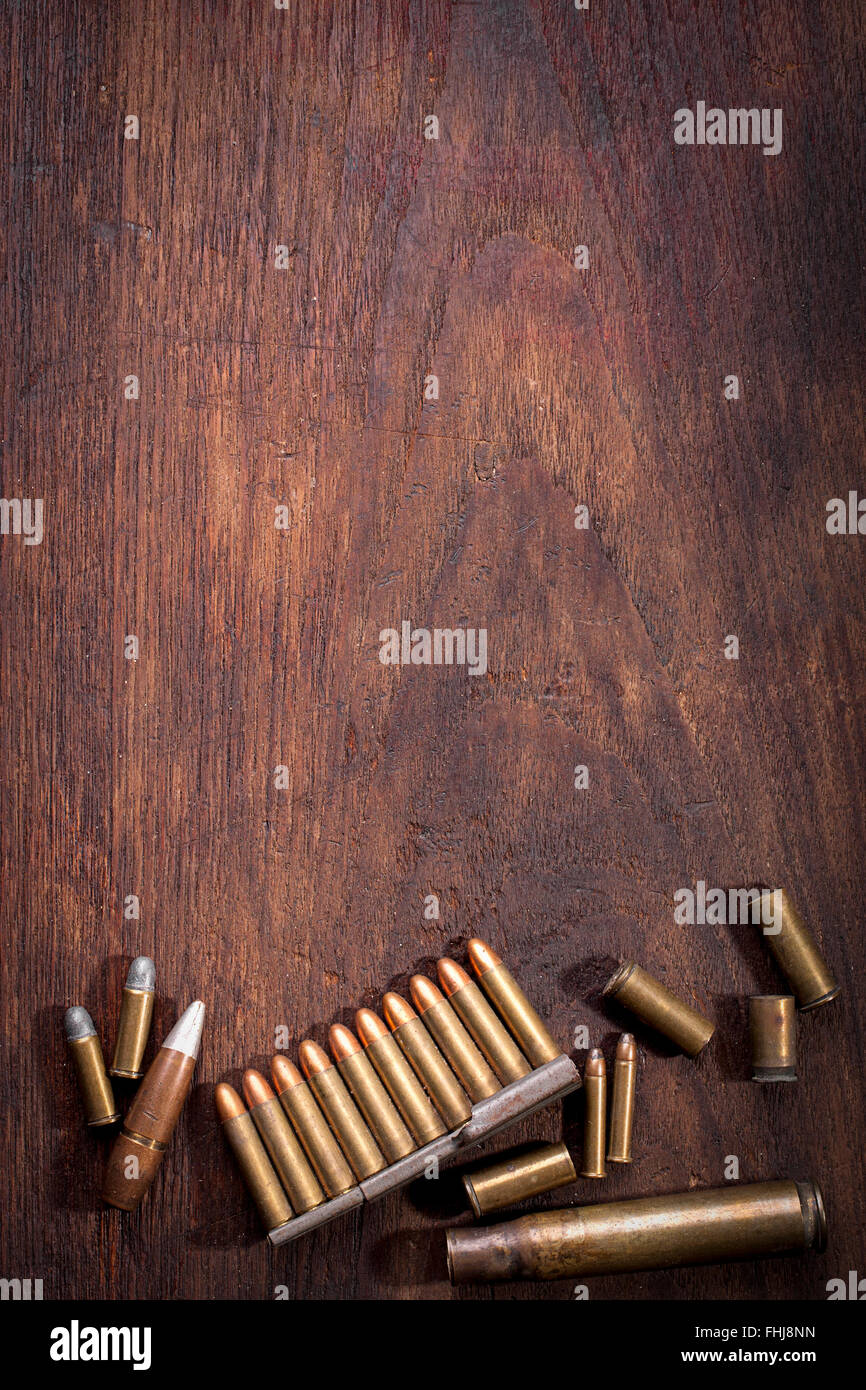 Old Bullet on wooden table with copy space Stock Photo - Alamy