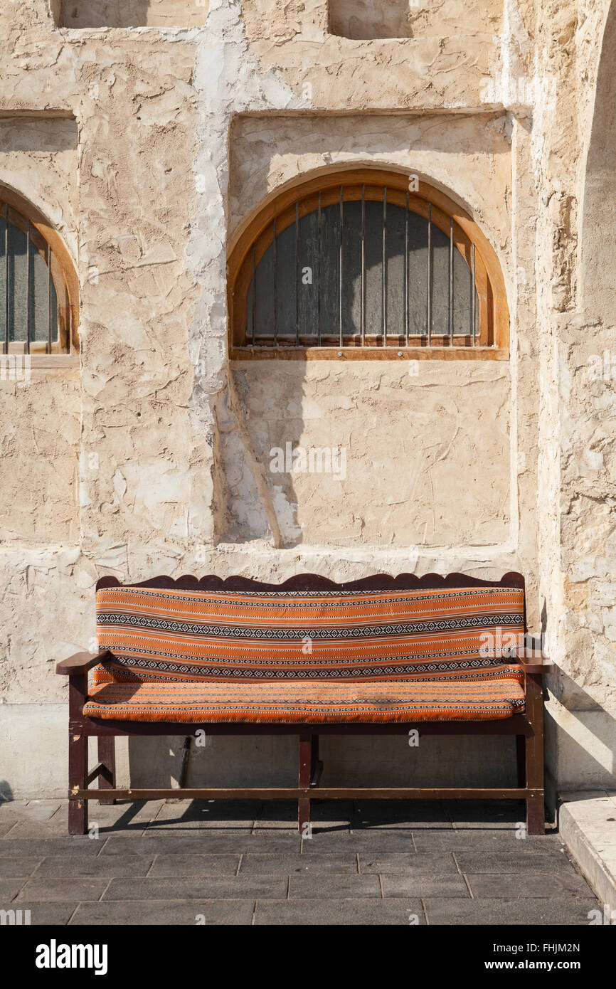Bench seat covered with traditional fabric at Souq Waqif, Doha, Qatar