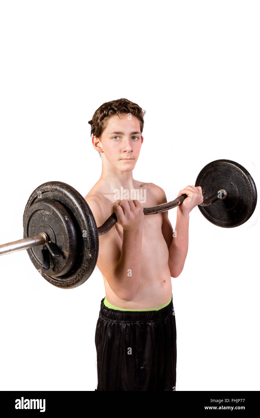 Shirtless Teenage Boy Lifting weights Stock Photo - Alamy