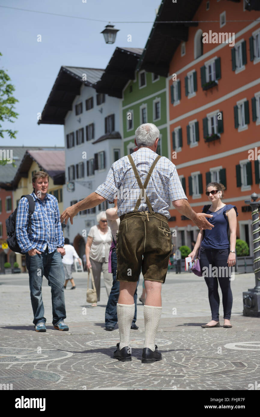 Tour guide in tradition Austrian Lederhosen leather shorts. Kitzbühel town  center. Austria. Europe Stock Photo - Alamy