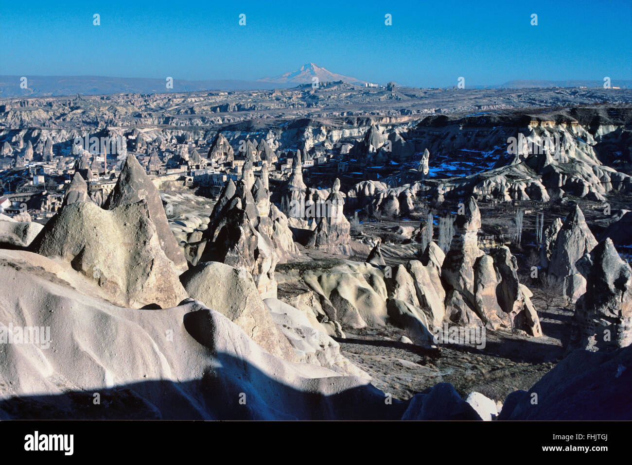 Volcanic Landscape of Weathered Tufa Rock and Fairy Chimneys or Hoodoos Cappadocia Turkey Stock Photo