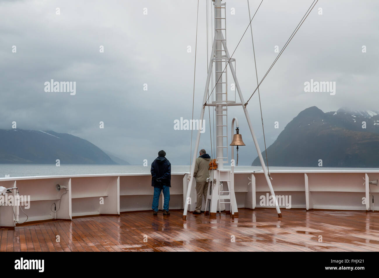 Passengers on board the cruise ship Veendam looking forward on the bow on Beagle Channel. Stock Photo
