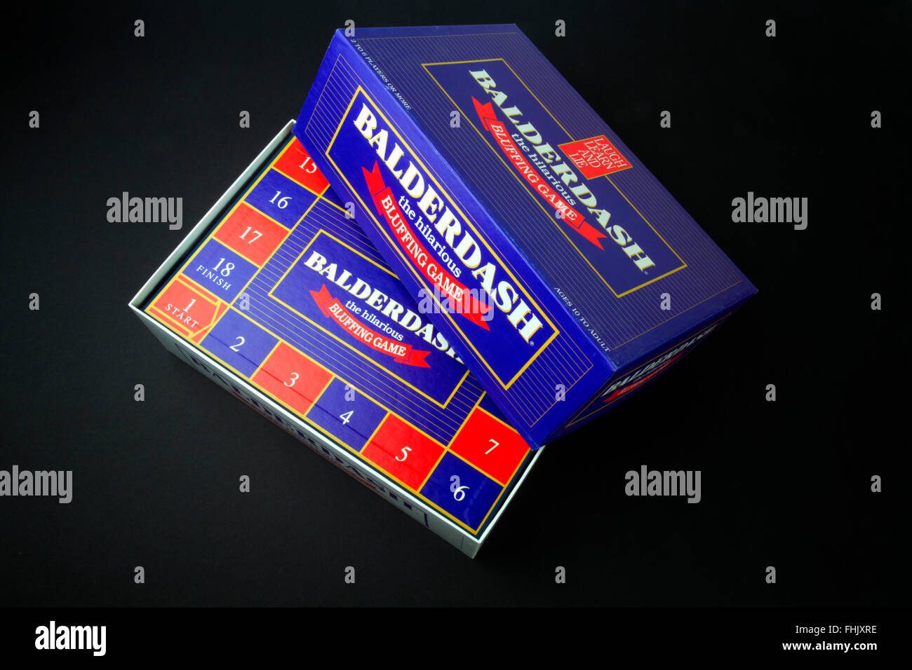 Balderdash bluffing board game on a black background Stock Photo - Alamy