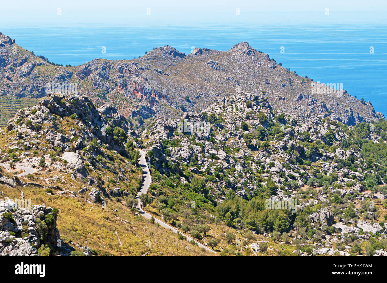 Mallorca, Balearic Islands, Spain: the winding road leading in Cala Tuent, a remote beach at the foot of the Serra de Tramuntana mountain range Stock Photo