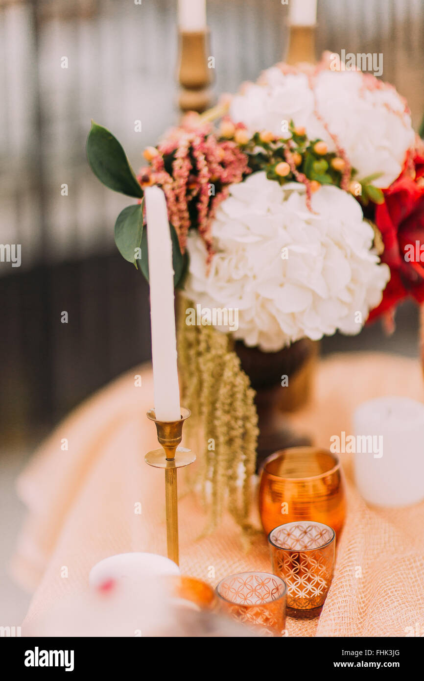 Wedding table with lovely candles close up Stock Photo - Alamy