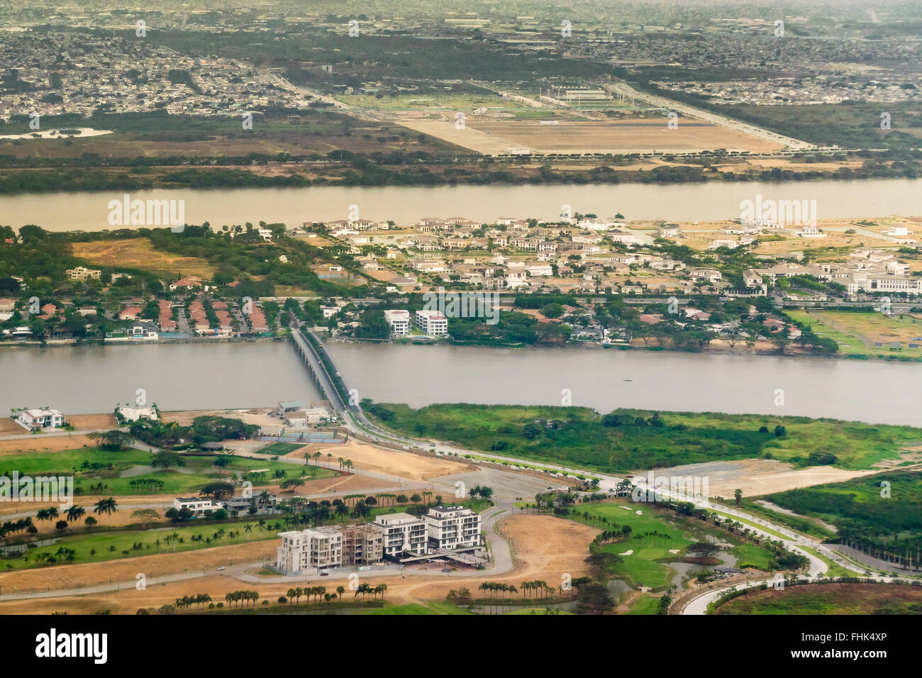 Aerial view of the capital of Ecuador, Guayaquil  from window  plane arriving to the airport. Stock Photo