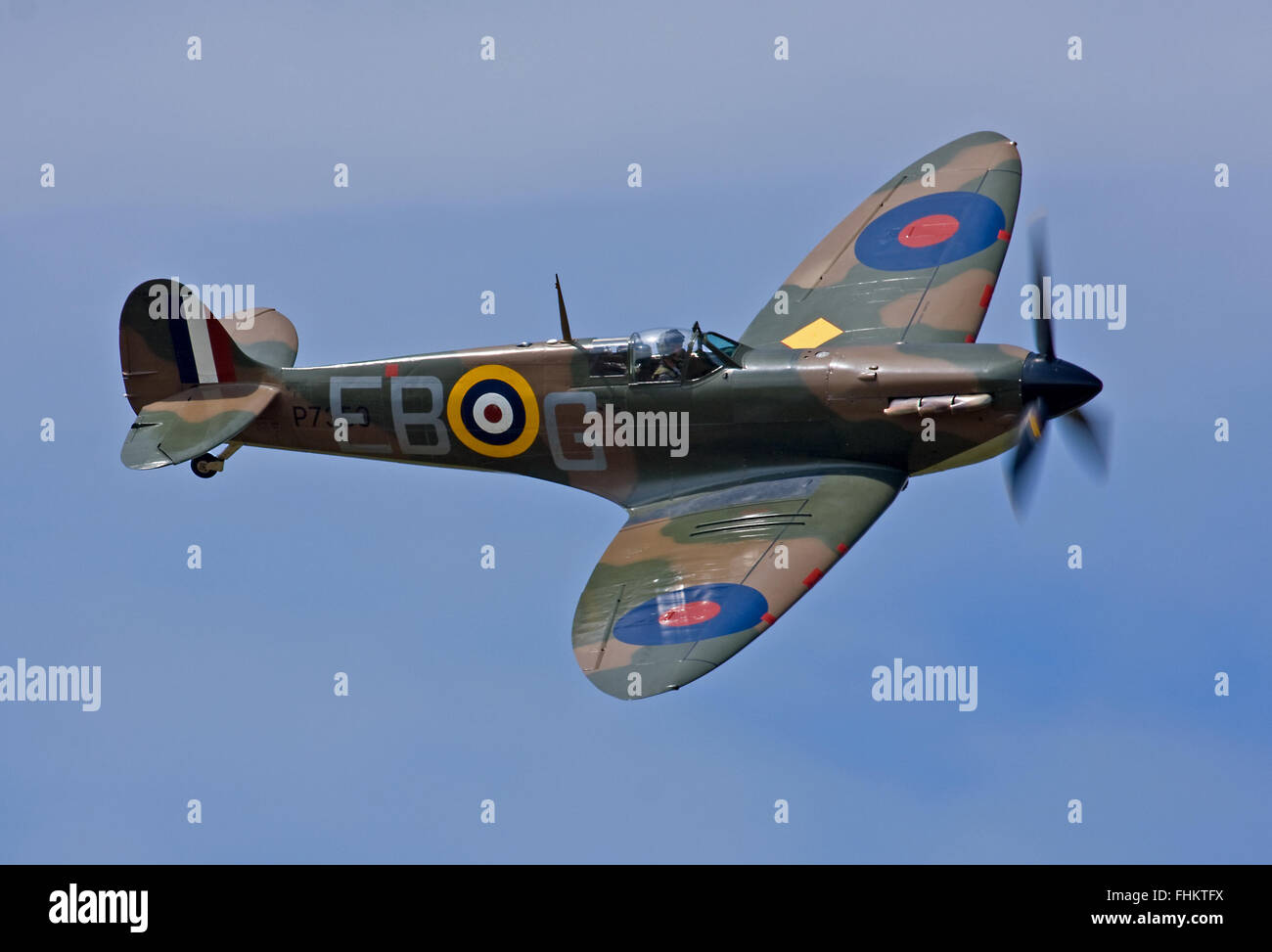 Battle of Britain veteran Spitfire Mk.IIa in blue skies at RAF Coningsby Stock Photo