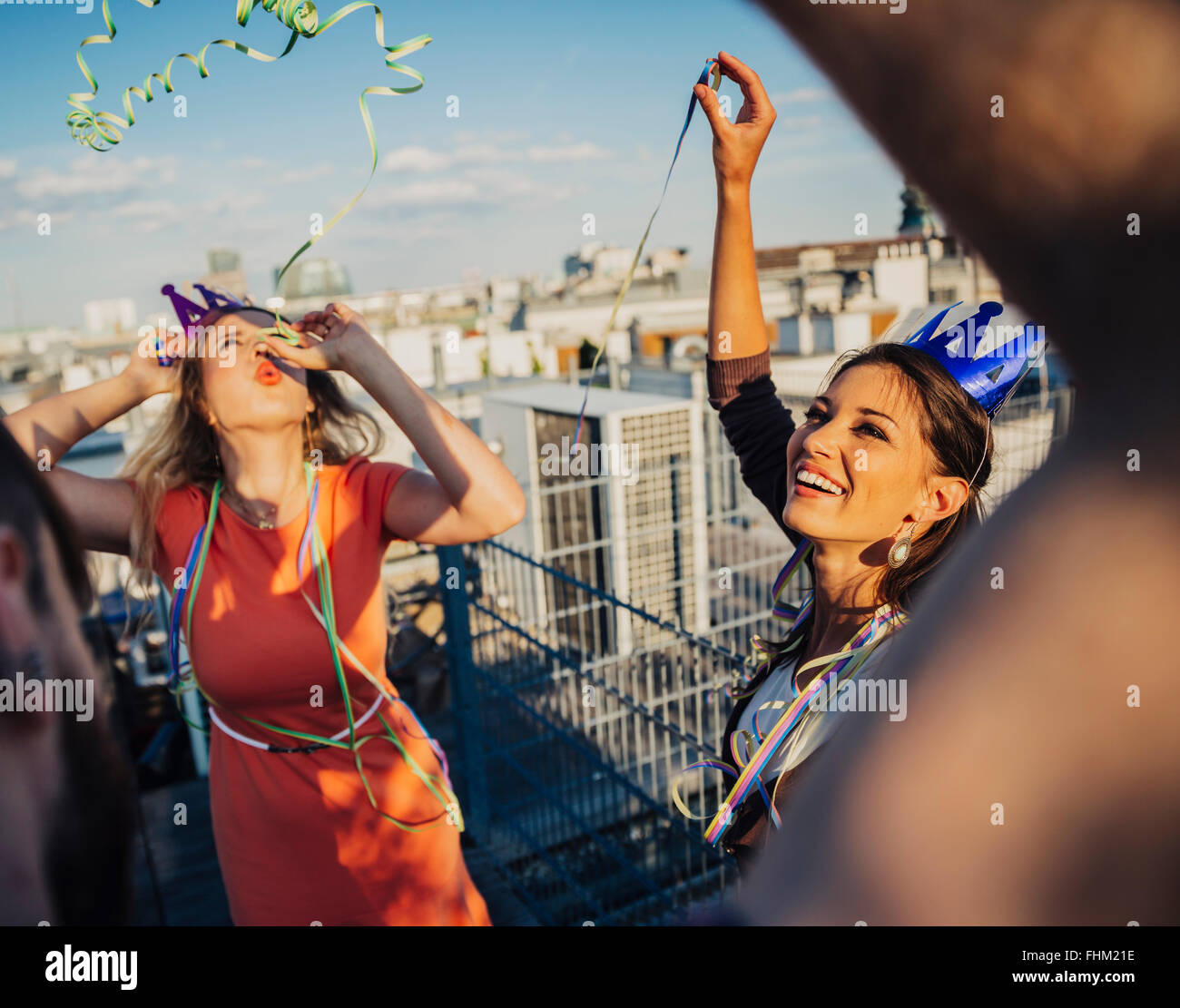 Austria, Vienna, Young people having a party on rooftop terrace Stock Photo