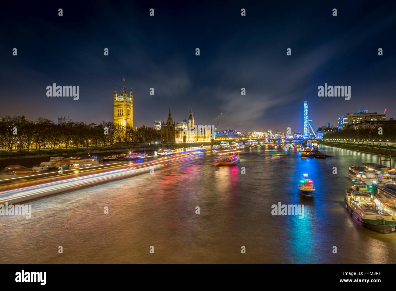 UK, London, view to River Thames with Palace of Westminster and London Eye at night Stock Photo