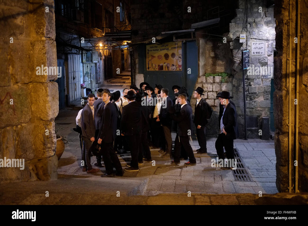 Jerusalem, Israel. 24th February, 2016. A group of Israeli religious Jews at the Muslim Quarter in the old city. East Jerusalem, Israel on 16 October 2015  The Housing Ministry has been funding security for settlers in East Jerusalem since the 1990s, through private security firms, who watch over ideological settlers who have implanted themselves in the heart of Palestinian neighborhoods in East Jerusalem. The number of Jews living in these areas is estimated at less than 3,000. Stock Photo