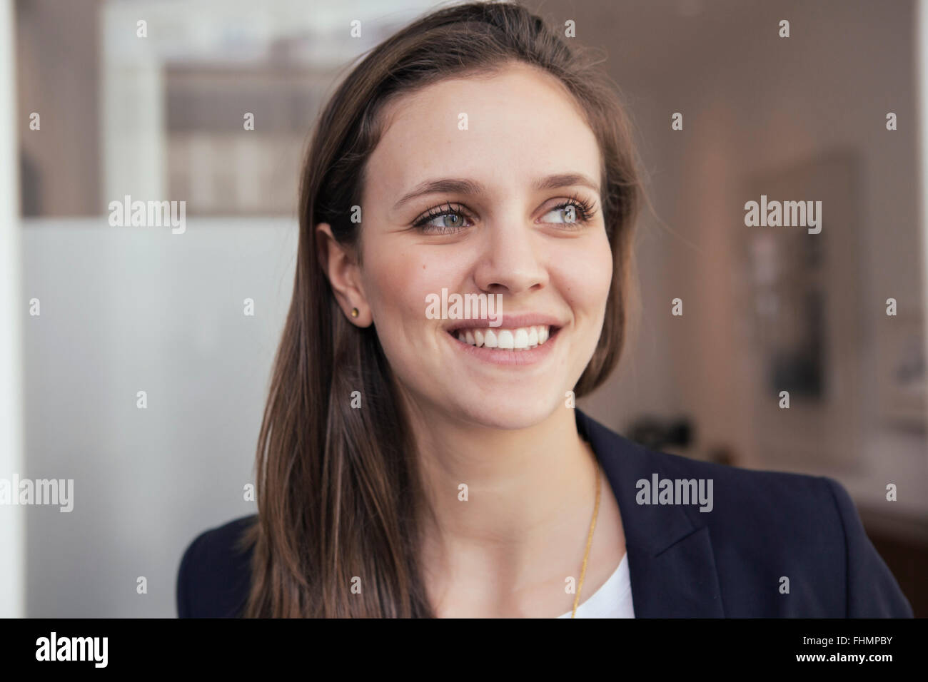Portrait of smiling young business woman Stock Photo - Alamy
