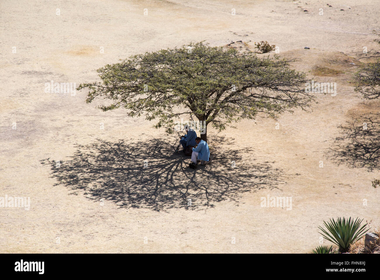 Oaxaca, Mexico - Souvenir sellers take shelter in the shade at Monte Albán, a major pre-Columbian archaeological site in Mexico. Stock Photo