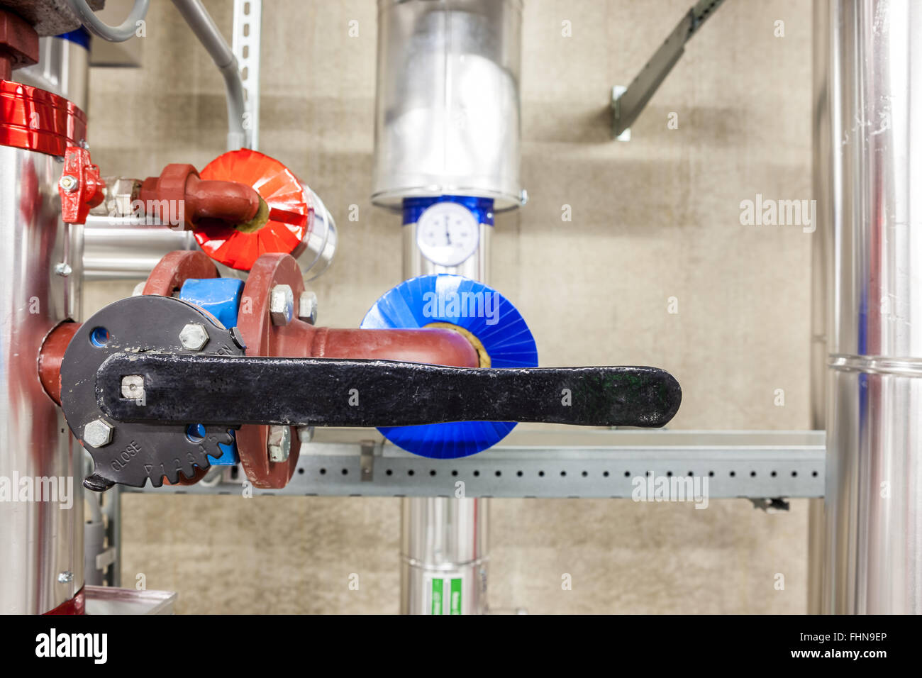 in an large building, there is an collector heating with an butterfly valve Stock Photo
