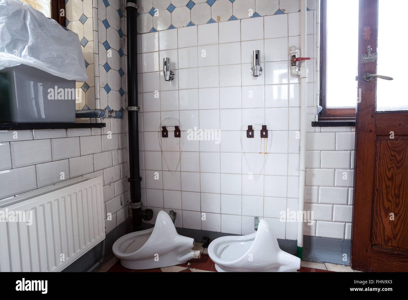 clogged urinals descaling of urinary stone and again placing the