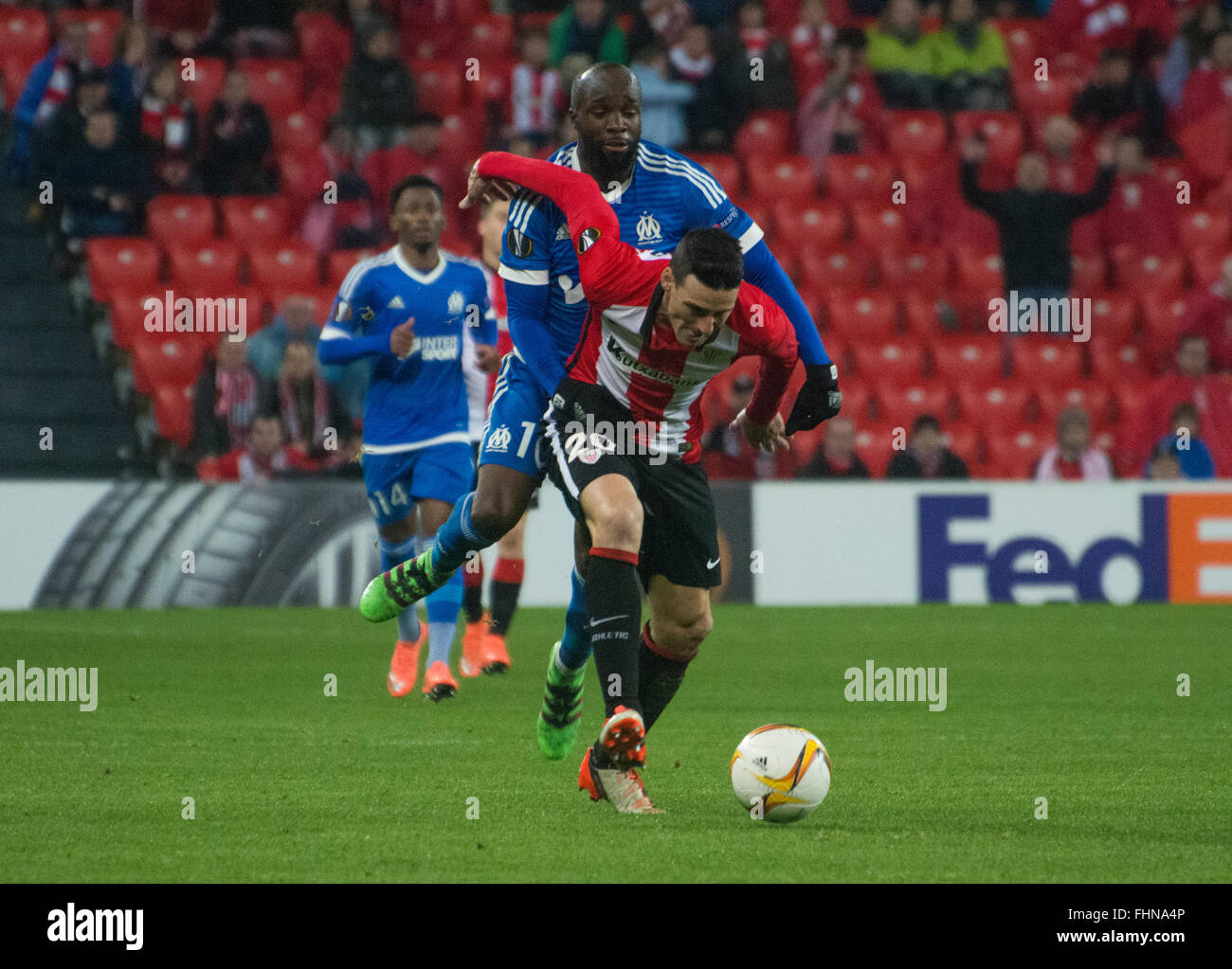 Bilbao, Spain. 25th February, 2016. Aritz Aduriz (Athletic Club) in action covered by Lassana Diarra (Olympique Marseille) during football match of UEFA Europe League between Athletic Club and Olympique de Marseille at San Mames Stadium on February 25, 2016 in Bilbao, Spain. Credit:  David Gato/Alamy Live News Stock Photo