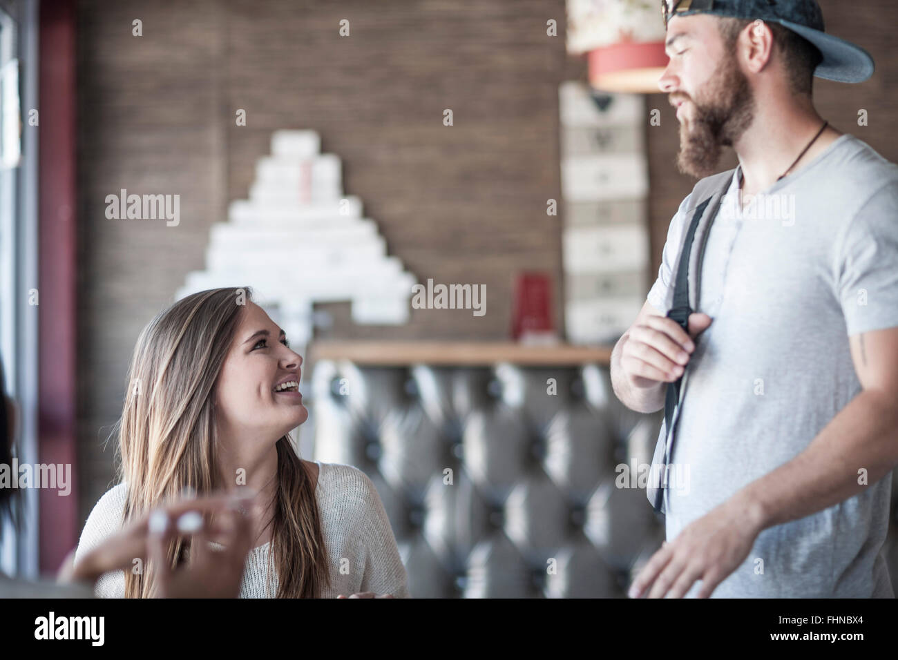 Friends talking in a coffee shop Stock Photo