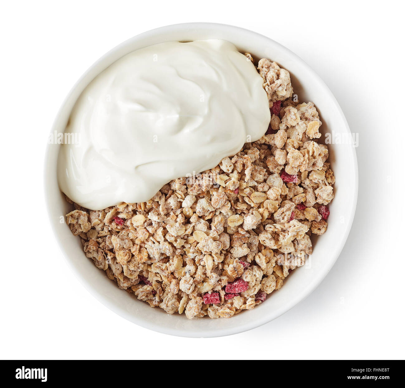 Bowl of whole grain muesli with yogurt isolated on white background, top view Stock Photo
