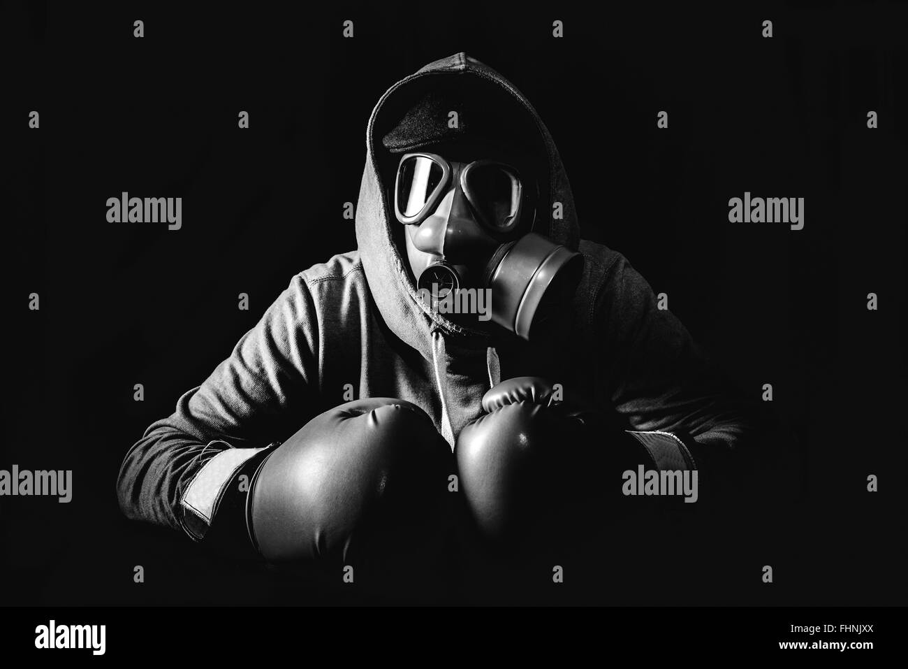 Angry man wearing gas mask and boxing gloves,low key and monochrome ...