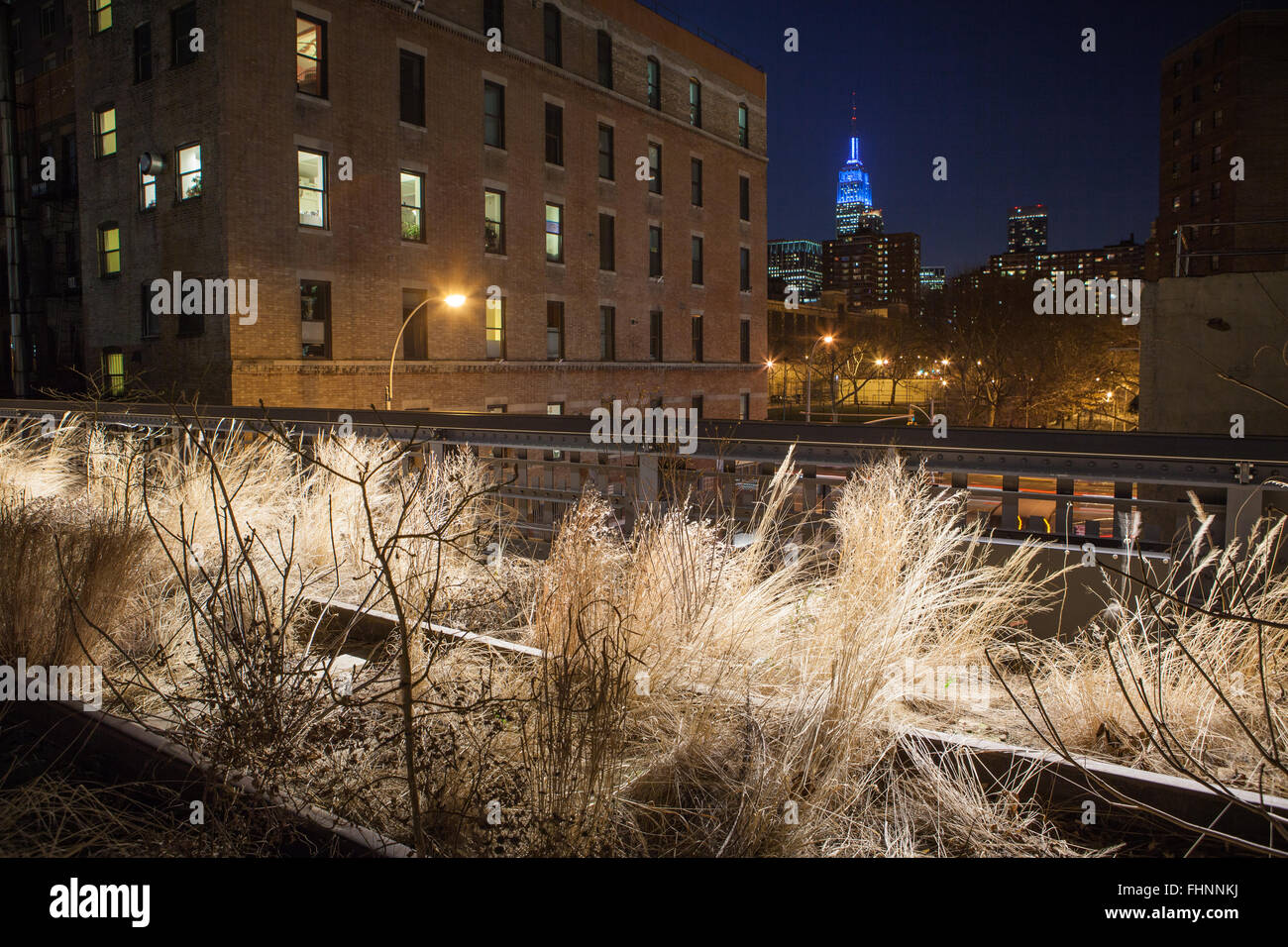 Walking along the High Line in New York City at Night. The old train ...