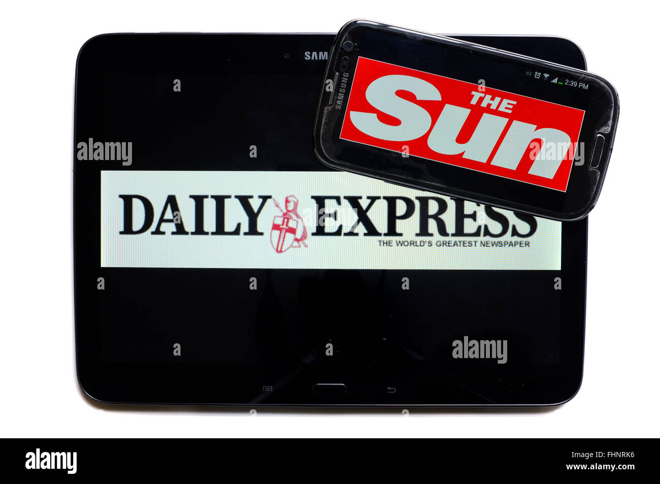 The logos of the Daily Express and The Sun newspapers displayed on the screens of a tablet and a smartphone. Stock Photo