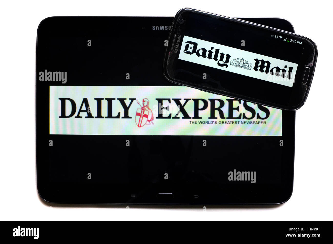 The logos of the Daily Express and The Mail newspapers displayed on the screens of a tablet and a smartphone. Stock Photo