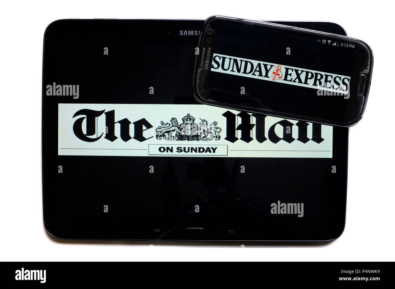 The logos of The Mail on Sunday and the Sunday Express newspapers displayed on the screens of a tablet and a smartphone. Stock Photo