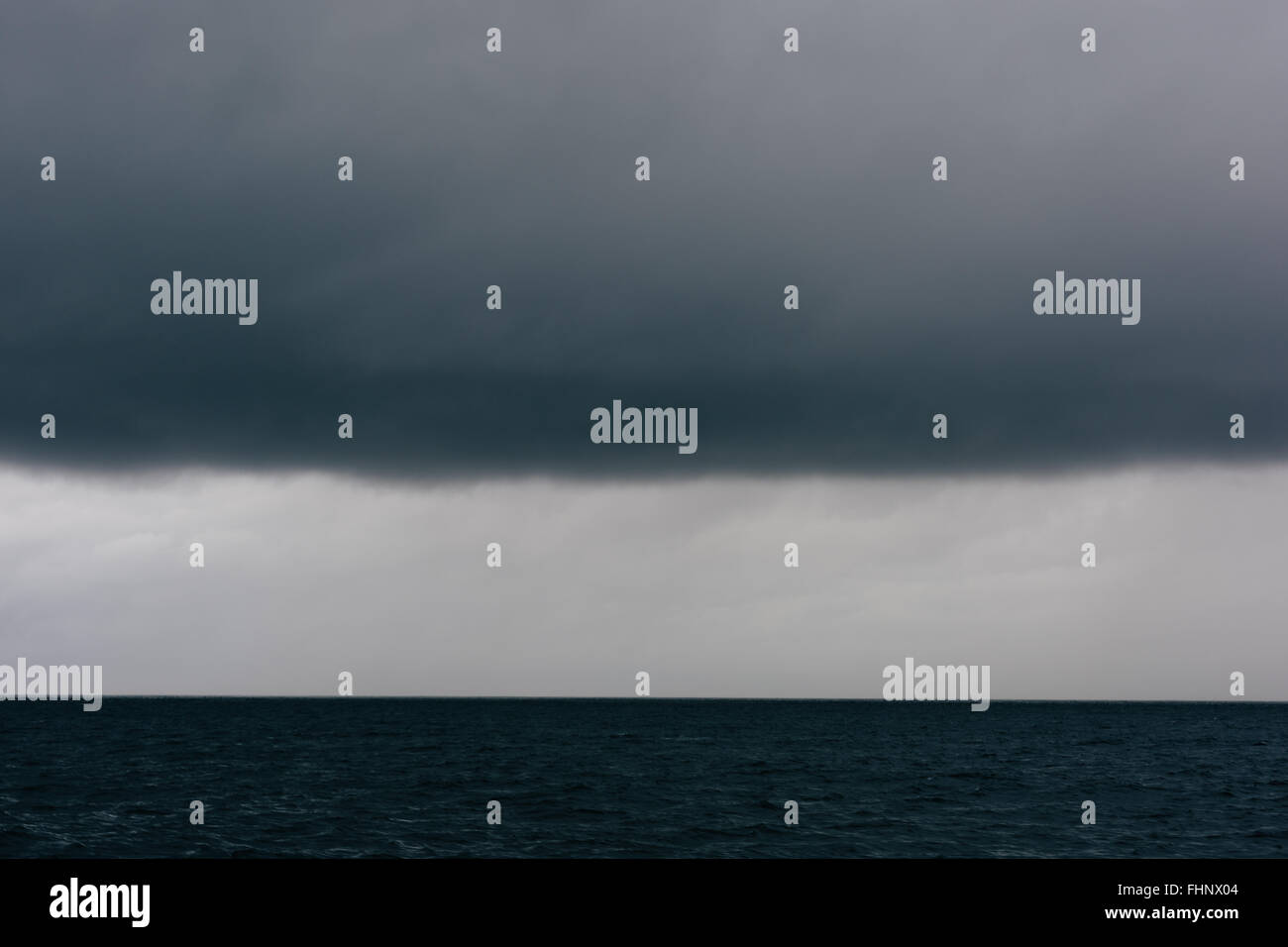 Storm clouds over the ocean Stock Photo - Alamy