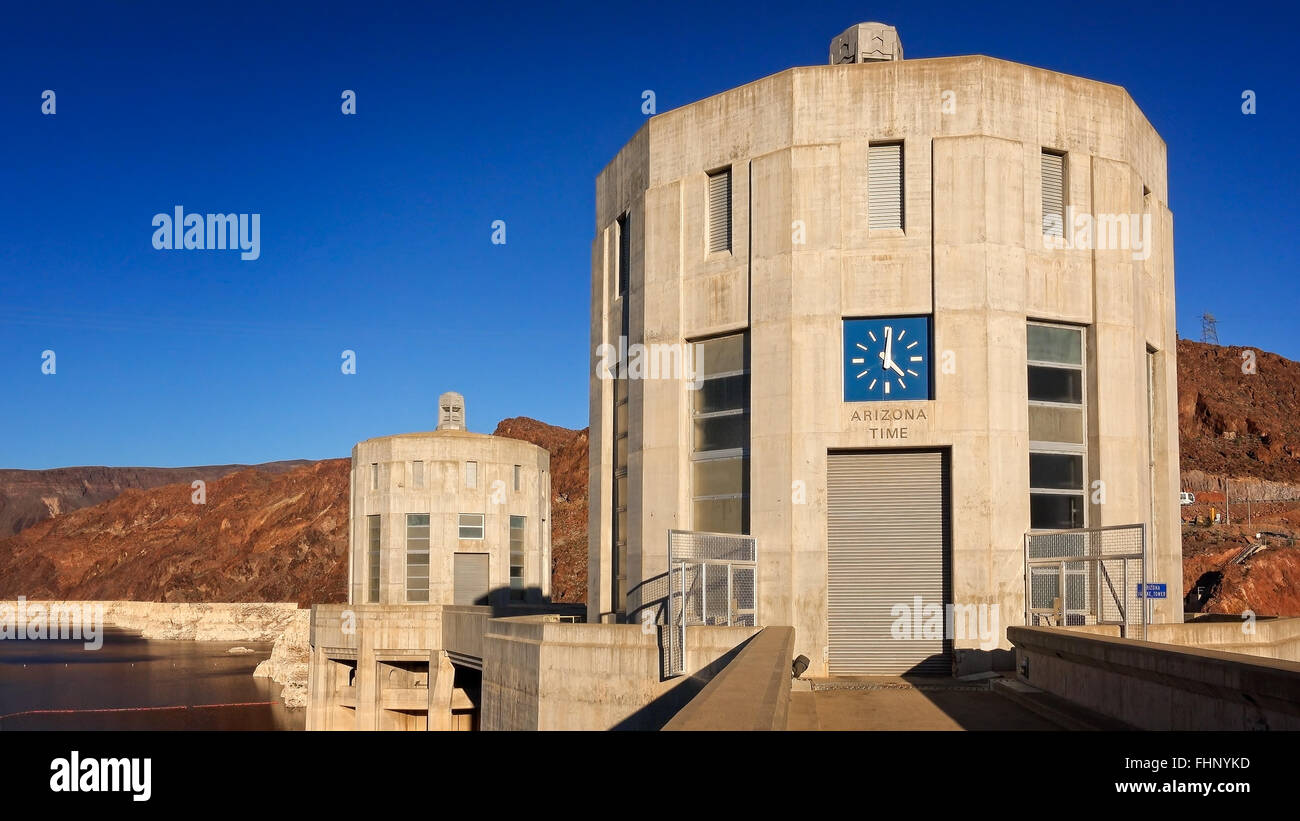 A clock showing Arizona time on the Arizona side of the Hoover Dam Stock Photo