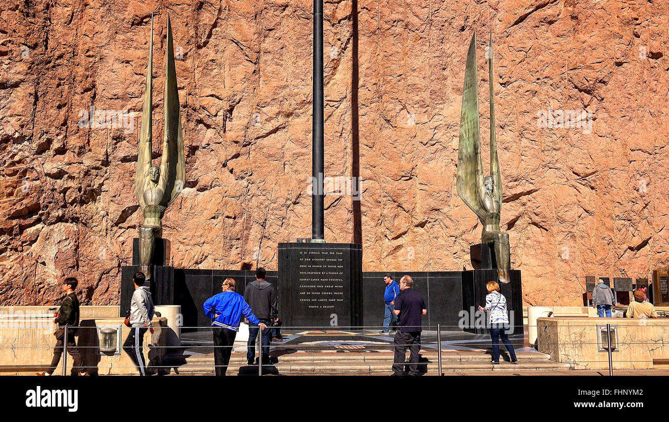 Tourists view the angel statues along a walkway at Hoover Dam Stock Photo
