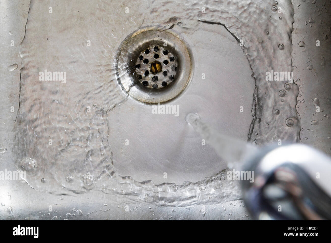 Water running through the sink Stock Photo Alamy