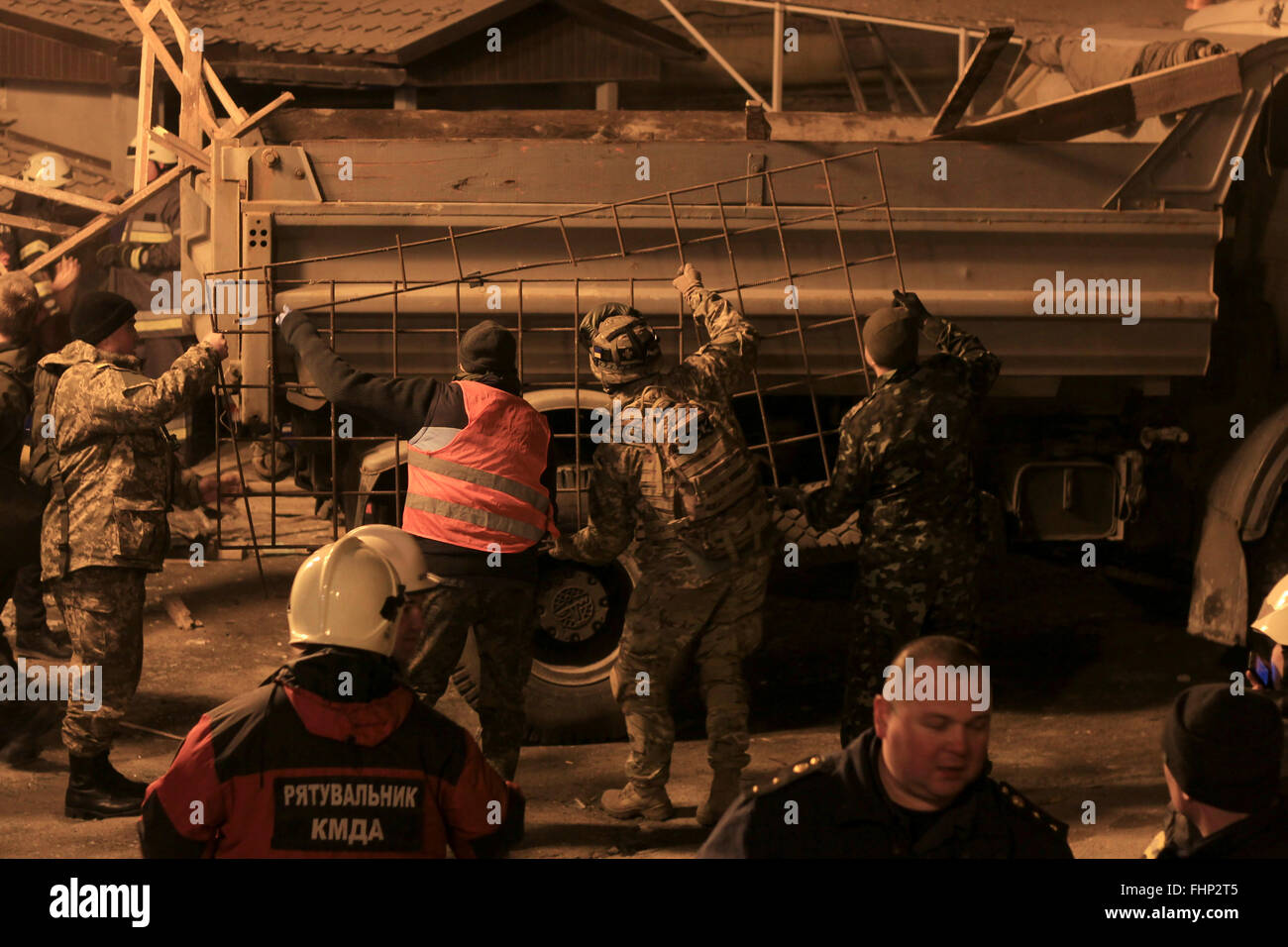 Kiev, Ukraine. 25th Feb, 2016. Ukrainian rescuers attend a rescue ...