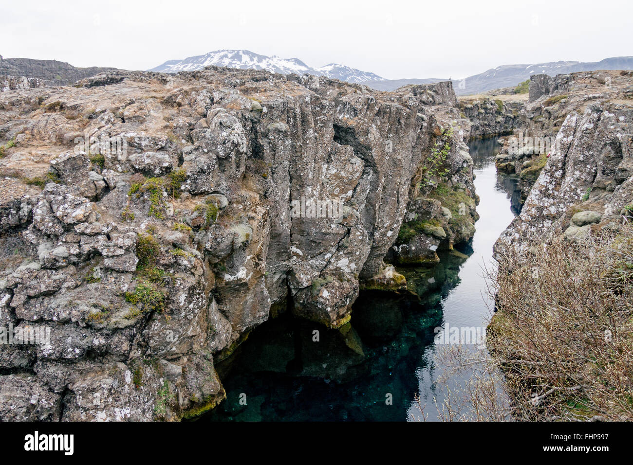 A crevice that separates two continental plates at Thingvellir National Park in Iceland. A popular tourist destination. Stock Photo