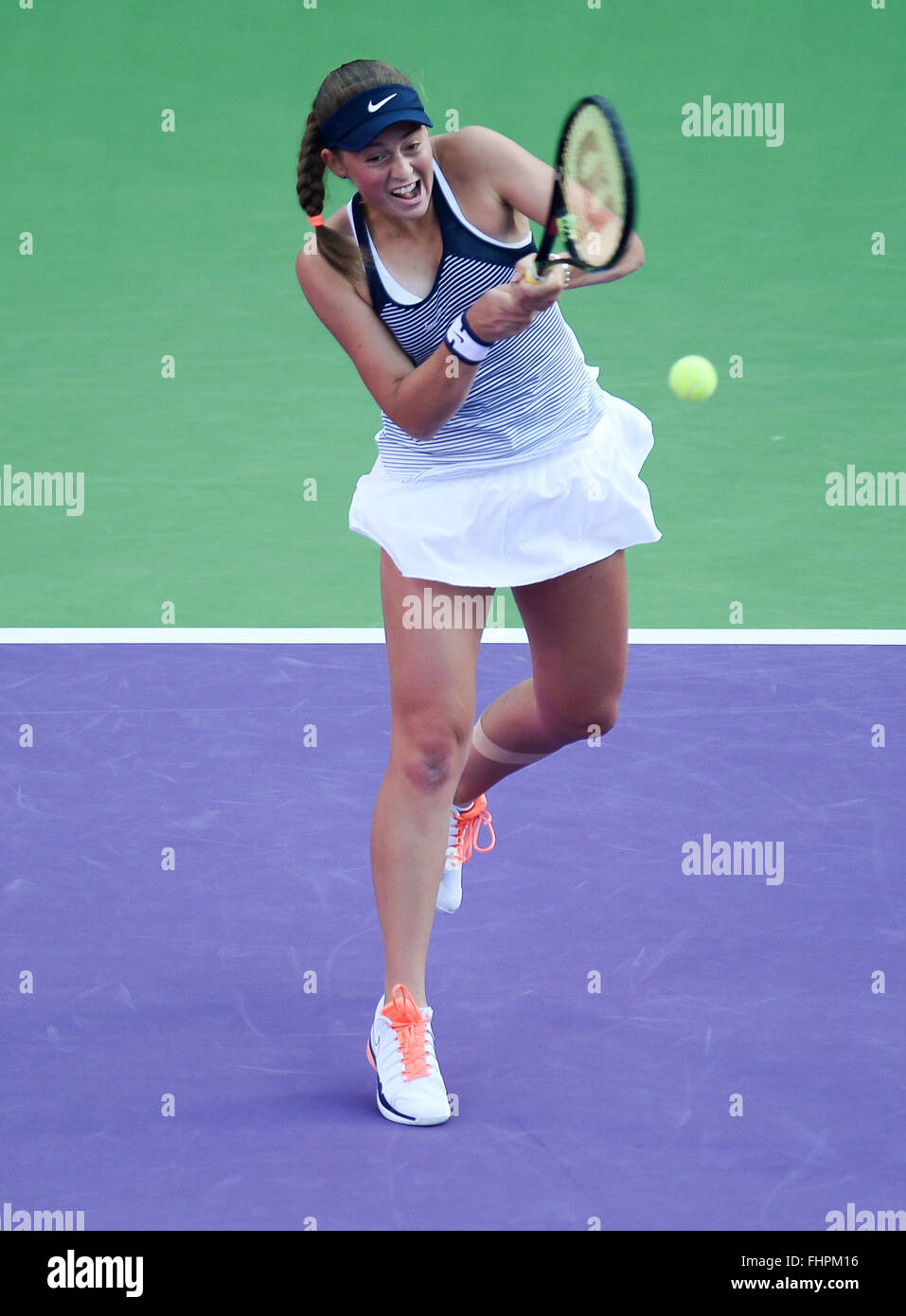 Doha, Qatar. 25th Feb, 2016. Jelena Ostapenko of Latvia competes during the women's singles quarterfinal match against Zheng Saisai of China at the WTA Qatar Open 2016 in Doha, Qatar, Feb. 25, 2016. Jelena Ostapenko won 2-0. © Nikku/Xinhua/Alamy Live News Stock Photo