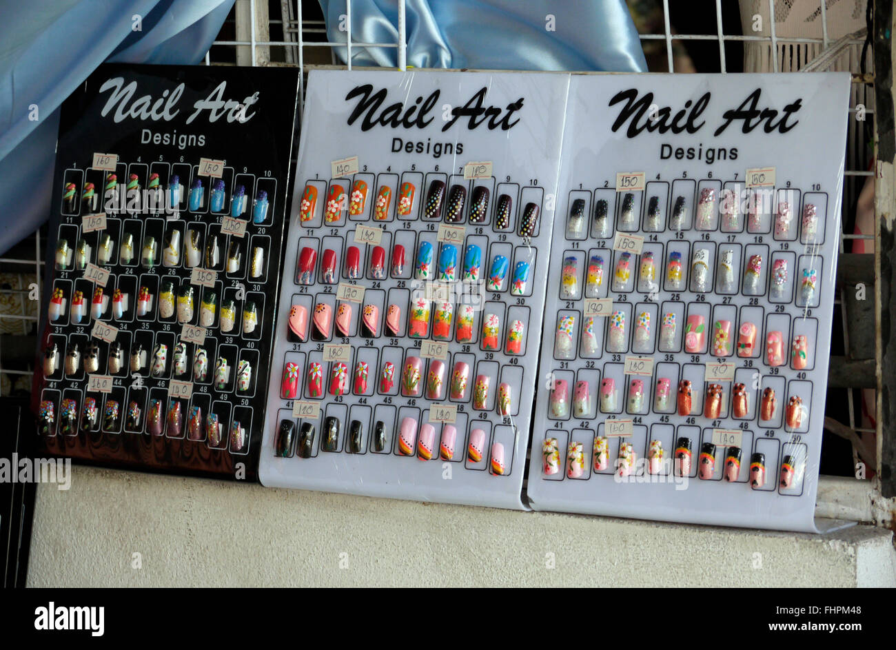 Artificial acrylic nails on display in Pattaya Thailand Stock Photo Alamy