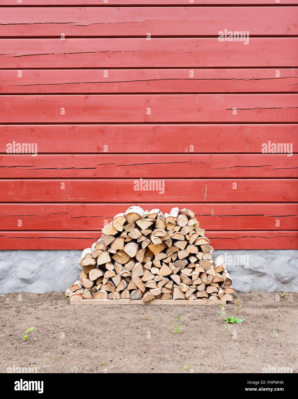 Firewood pile stored outside Stock Photo Alamy