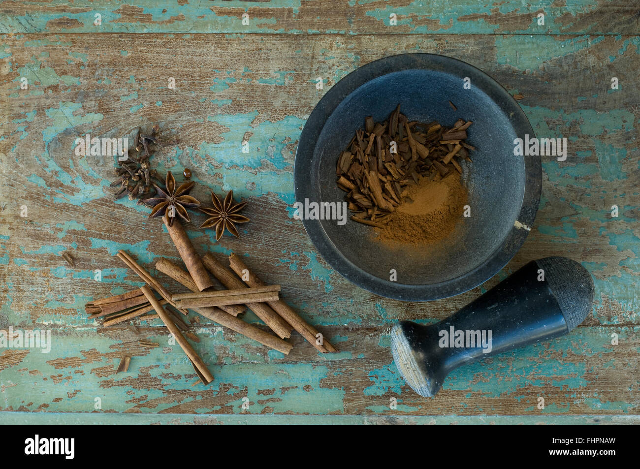 Christmas spices and mortar on wood Stock Photo