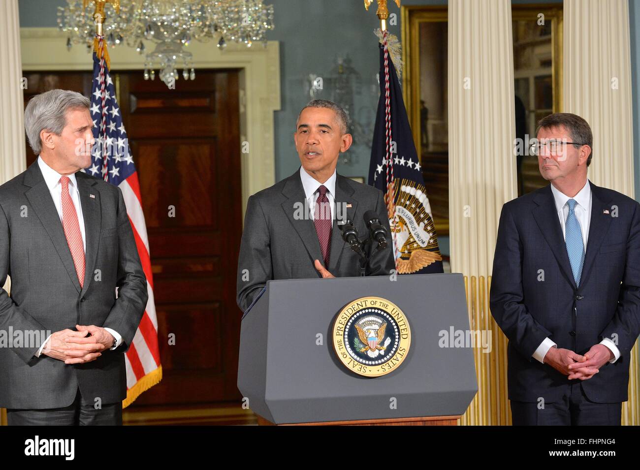 Washington DC, USA. 25th February, 2016. U.S President Barack Obama flanked by Secretary of State John Kerry and Defense Secretary Ashton Carter, addresses the media following a meeting with the National Security Council on the global campaign to degrade and destroy ISIL at the State Department February 25, 2016 in Washington, DC.  Obama ordered his national security team to 'continue accelerating' the U.S led military campaign against the Islamic State. Stock Photo