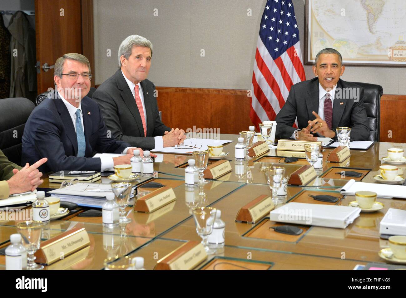 Washington DC, USA. 25th February, 2016. U.S President Barack Obama flanked by Secretary of State John Kerry and Defense Secretary Ashton Carter, during a meeting with the National Security Council on the global campaign to degrade and destroy ISIL at the State Department February 25, 2016 in Washington, DC.  Obama ordered his national security team to 'continue accelerating' the U.S led military campaign against the Islamic State. Stock Photo