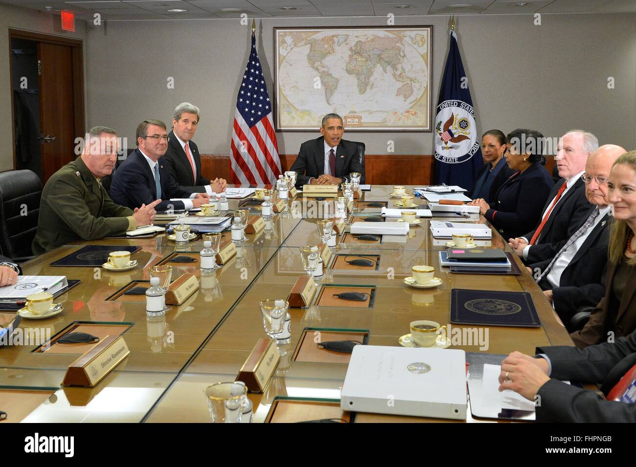Washington DC, USA. 25th February, 2016. U.S President Barack Obama flanked by Secretary of State John Kerry and Defense Secretary Ashton Carter and Joint Chiefs Chairman Gen. Joseph Dunford, during a meeting with the National Security Council on the global campaign to degrade and destroy ISIL at the State Department February 25, 2016 in Washington, DC.  Obama ordered his national security team to 'continue accelerating' the U.S led military campaign against the Islamic State. Stock Photo