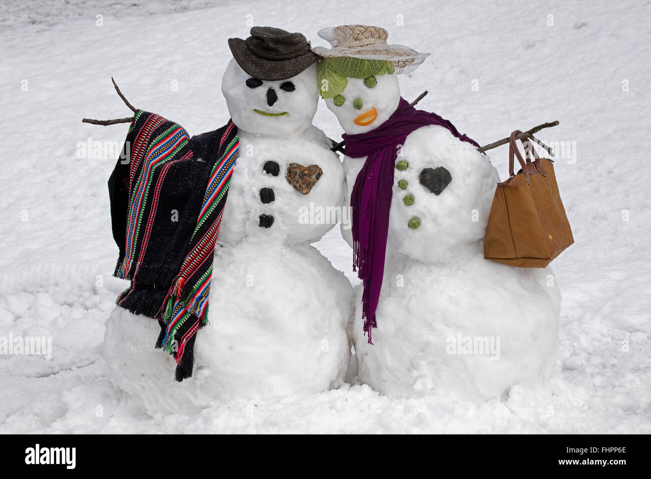 Snow couple, Washington DC area, after winter storm Stock Photo