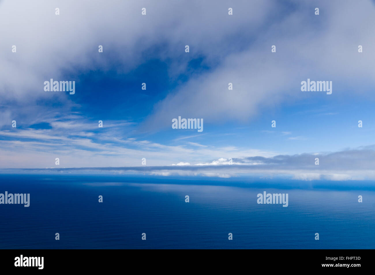 Cloudy sky and calm ocean background, high angle view Stock Photo
