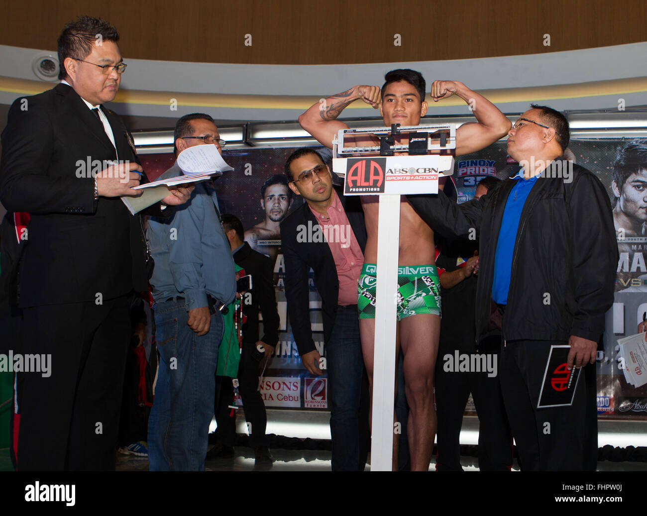 Cebu city, Philippines. 26th February, 2016. Weigh-In for Pinoy Pride 35 'Stars of The Future'. WBO Youth Featherweight Champion & highly rated Filipino prospect Mark 'Magnifico' Magsayo (W12-L0-D0 Philippines) puts his belt on the line against Eduardo 'Fierita' Montoya (W17 L4 D1 Mexico) Magsayo on scales. Credit:  imagegallery2/Alamy Live News Stock Photo