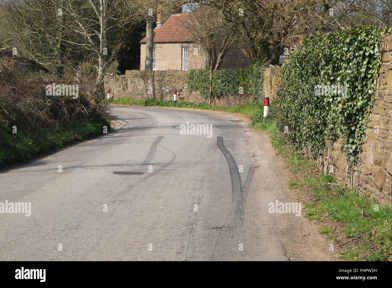 Fast car skid tyre marks left by a driver in a rush Stock Photo
