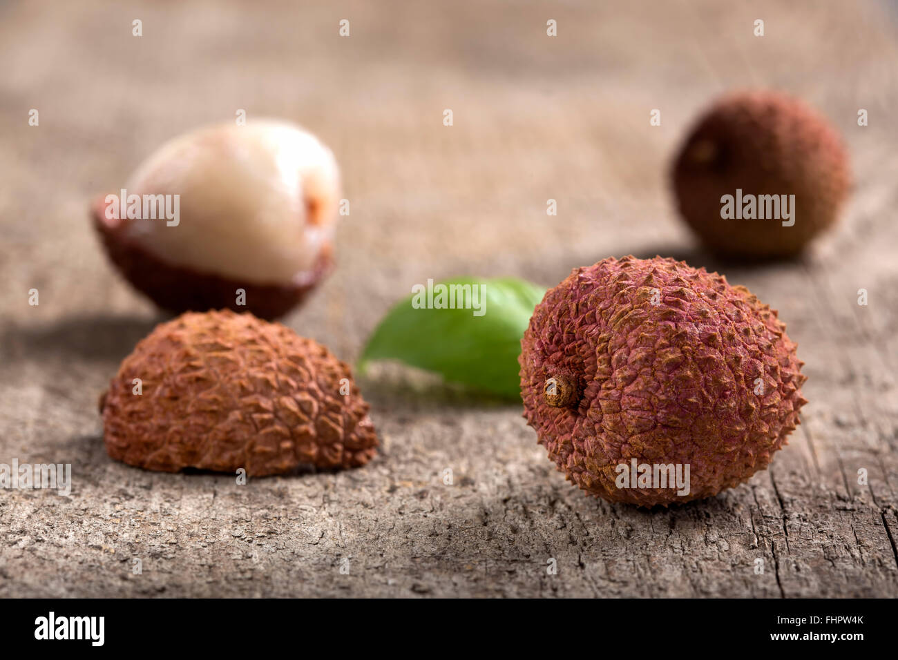 Fresh lychee on a wooden background Stock Photo