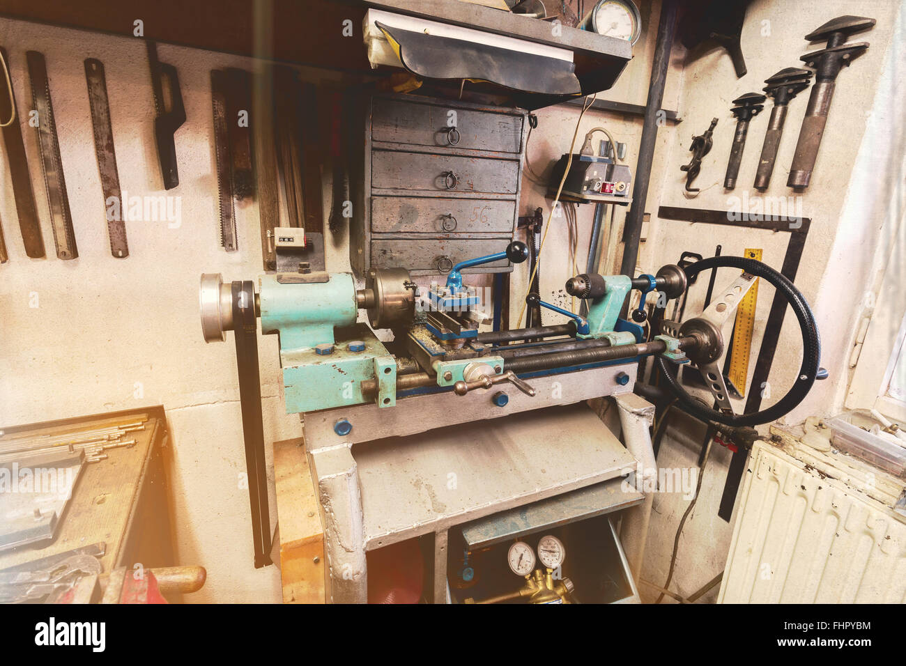 real domestic DIY home workshop full of tools, untidy, ready for work,  detail of homemade lathe, retro vintage color tone Stock Photo - Alamy