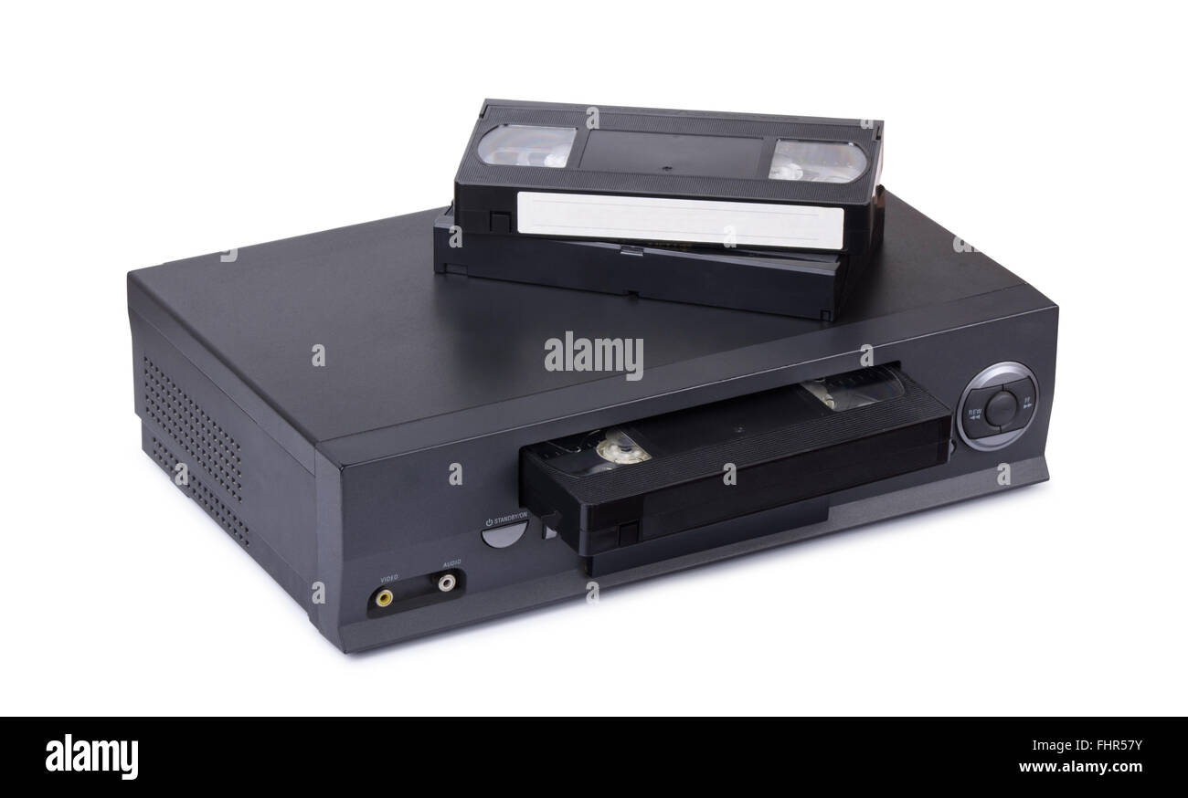 Old VHS video recorder with cassettes isolated on white background Stock Photo