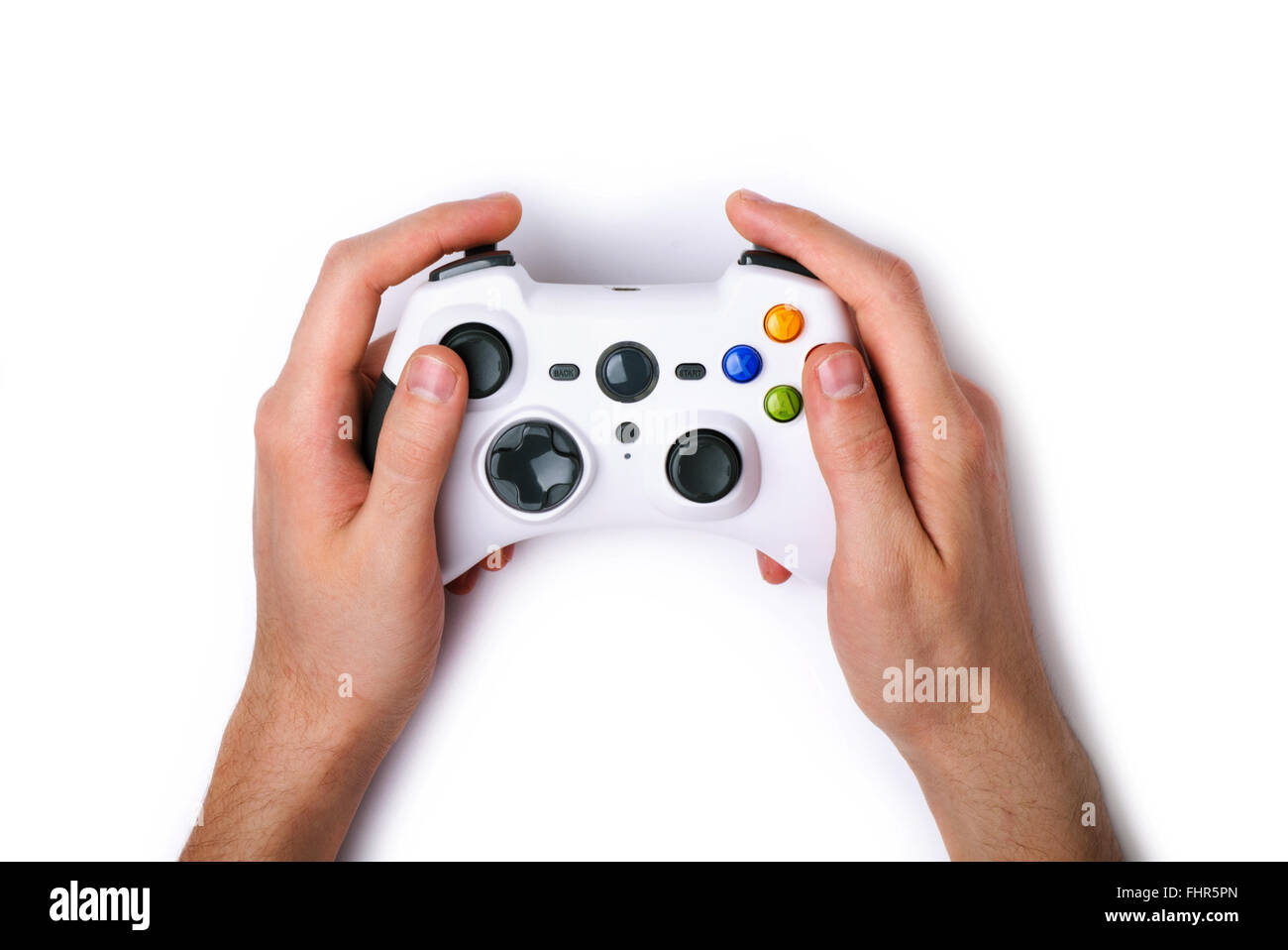 Video game console controller in gamer hands isolated on white background Stock Photo